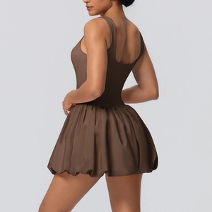 Dark brown backless athletic tennis dress with flared skirt shown from a side-back view