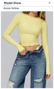 Close-up of goose yellow long sleeve yoga top with high-stretch knitted fabric detail