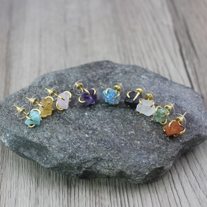 Irregular raw crystal claw stud earrings set in various natural stones with gold plating