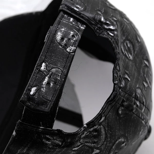 Faux leather baseball cap with a silver metallic skull print and adjustable back strap