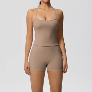 Close-up of khaki two-piece yoga set with strappy camisole and high-waist fitness shorts