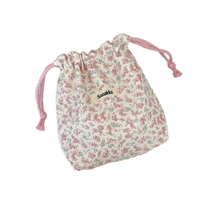 Floral cotton drawstring storage bag with pink cords and Sozakka label on white background