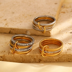 Polished multi-layer stainless steel ring set with cubic zirconia and linked bands