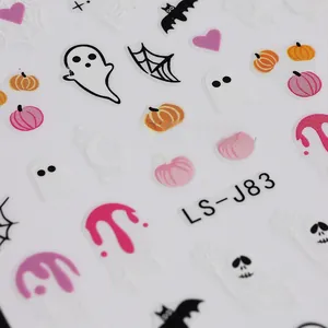 Macro detail of 3D embossed Halloween nail stickers with ghosts and pumpkins
