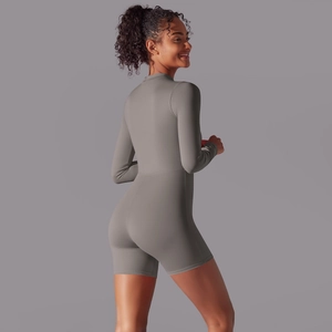 Close-up of seamless stitching and body-con fit on a dark grey athletic bodysuit