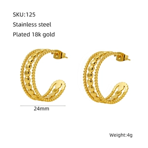 Detail view of 24mm hollow star hoop earrings in 18k gold plated stainless steel