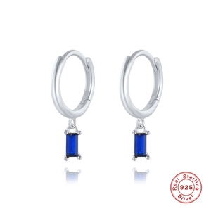 Detail of S925 sterling silver hoop earrings with rectangular blue zircon stones