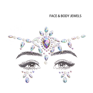 Detailed crown-shaped iridescent rhinestones and pearls face jewel set on a white card