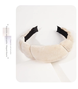 Close-up of velvet padded headband with pleated texture and soft silk sheen