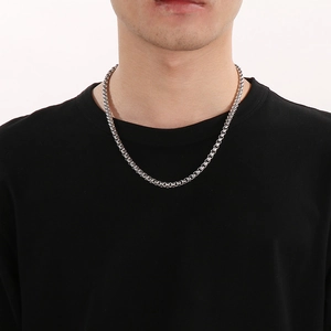 Classic silver stainless steel pearl chain necklace displayed on a male model neck