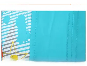 Close-up of triple stitching craftsmanship and star pattern on light blue mesh fabric
