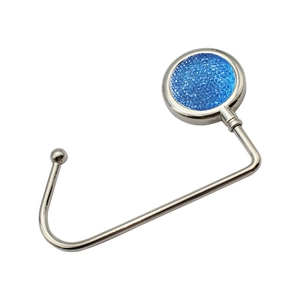 Foldable silver metal handbag hook with sparkling blue glitter decorative top