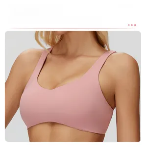 Detail of nude pink yoga bra featuring a U-neckline and removable chest pads
