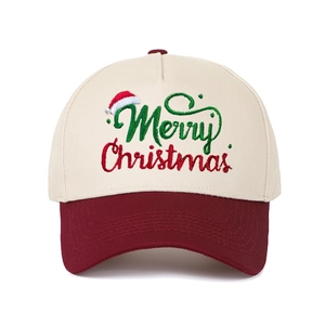 Detail of Merry Christmas embroidery on cream and burgundy cotton baseball cap