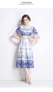 Detail of elegant hollow water-soluble lace and blue floral print on midi dress