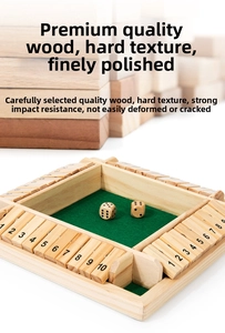Detail of wooden four-sided Shut the Box game board with green felt and dice