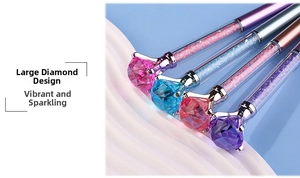 Detail of four colorful crystal ballpoint pens with large diamond top and sparkly refills