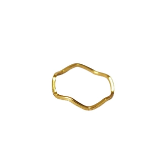 Minimalist gold plated wavy ring featuring a slim stackable design on a white background