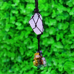 Detailed close-up of handmade woven crystal stone hanging ornament with colorful beads