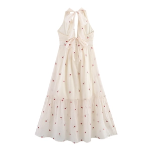 Back view of a backless halter neck floral maxi dress with large bow ties in cream white