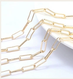Macro detail of 14k gold-plated paperclip chain for DIY jewelry making accessories