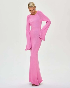 Close-up of pink knitted long dress with ruffled hem and slim fit mermaid silhouette
