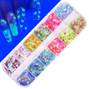 Close-up of 12-grid nail art butterfly sequins with fluorescent and luminous glow effects