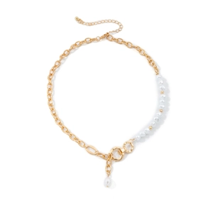 Detailed view of vintage asymmetric gold chain and pearl necklace with lobster clasp