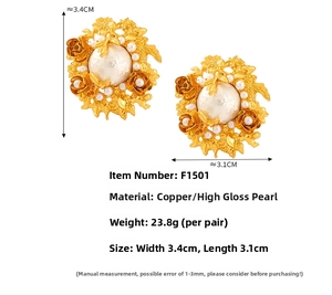 Detail view of Baroque gold floral earrings featuring glossy shell pearls and copper texture