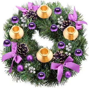 Christmas wreath with 4 golden candle holders, purple bows, and pine cones on white base
