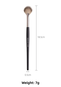 Macro shot of a fan makeup brush with black matte handle and soft gradient bristles