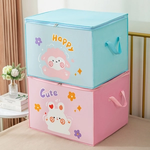 Detail of stacked blue and pink fabric storage bags with cute cartoon animal prints