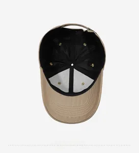 Internal view of khaki cotton baseball cap showing black sweatband and metal buckle