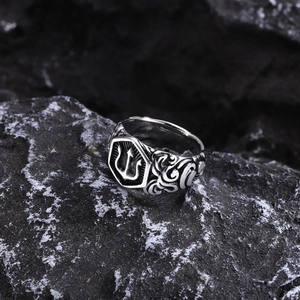 Vintage stainless steel trident ring for men with side scroll engravings on black stone