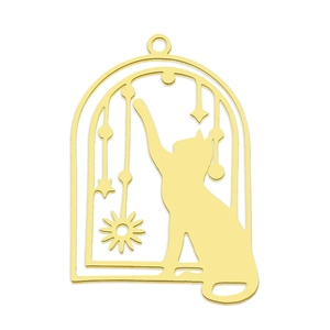 Detail of a golden stainless steel cat pendant with celestial sun and moon motifs