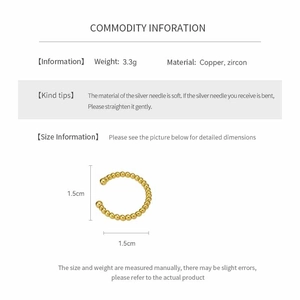 Detail view of 18k gold plated C-shaped earring with zircon stones and 1.5cm diameter