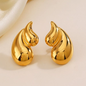 Elegant 18K gold plated stainless steel teardrop earrings on a soft beige silk background