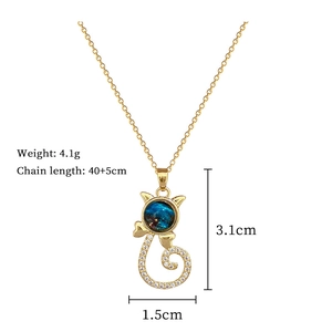Detail showing gold cat pendant with blue star stone and 3.1x1.5cm dimension specs