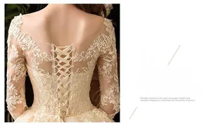 Dettaglio dell'abito da sposa in pizzo avorio con chiusura a corsetto regolabile sulla schiena