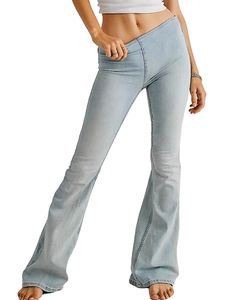 Detail of light blue flared denim jeans with vintage wash and wide leg leg silhouette