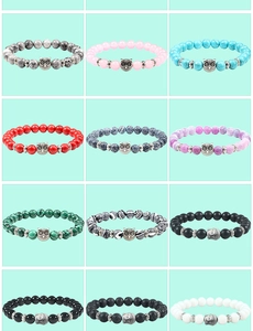 Multiple beaded bracelets with natural volcanic stone and owl or Buddha head alloy charms
