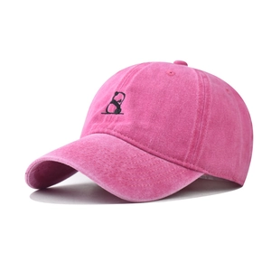 Close-up of pink washed cotton baseball cap featuring detailed panda embroidery