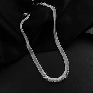 Close-up of wide flat silver snake chain with lobster clasp and adjustable extension