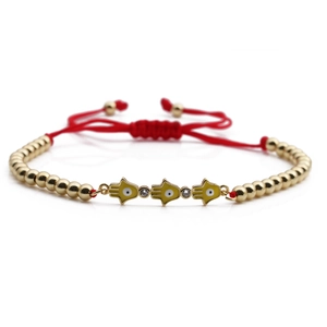 Adjustable red rope Hamsa hand bracelet with gold beads and yellow enamel charms