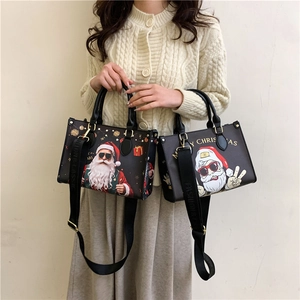 Black tote bags featuring cartoon Santa Claus with Merry Christmas print and wide strap
