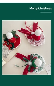 Detail of Christmas hair clips with lace, ribbons and pom-poms in festive red and green