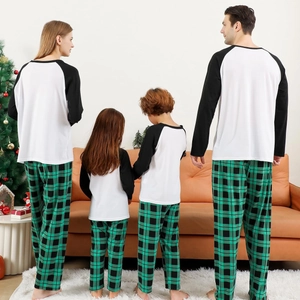 Family matching pajamas set with black sleeves and green plaid pants for Christmas holiday