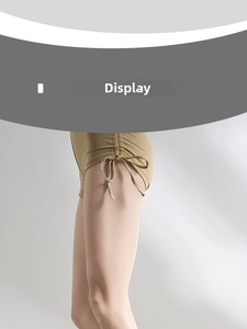 Detail view of khaki high-waisted shorts featuring adjustable side drawstrings and bow details