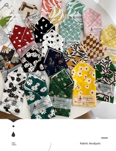 Detail of floral and heart pattern cotton linen scarves with unique paper packaging