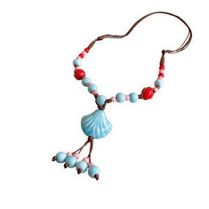 Bohemian multilayer ceramic necklace with blue shell pendant and hand-woven cord
